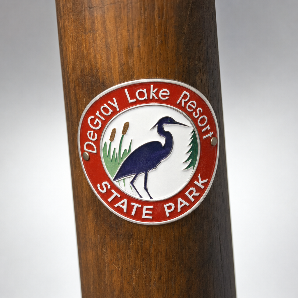 DeGray Lake Resort State Park hiking stick medallion installed on a wooden hiking staff