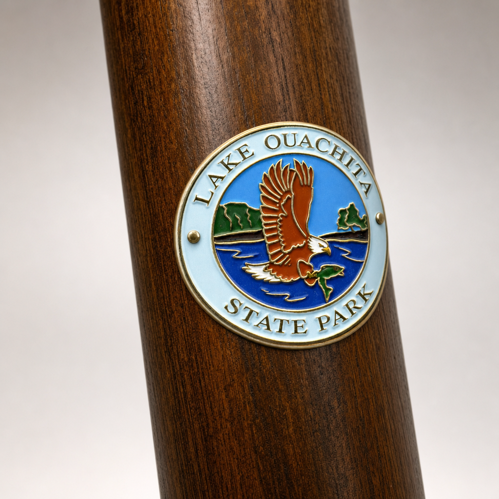 Lake Ouachita State Park hiking stick medallion installed on a wooden hiking staff