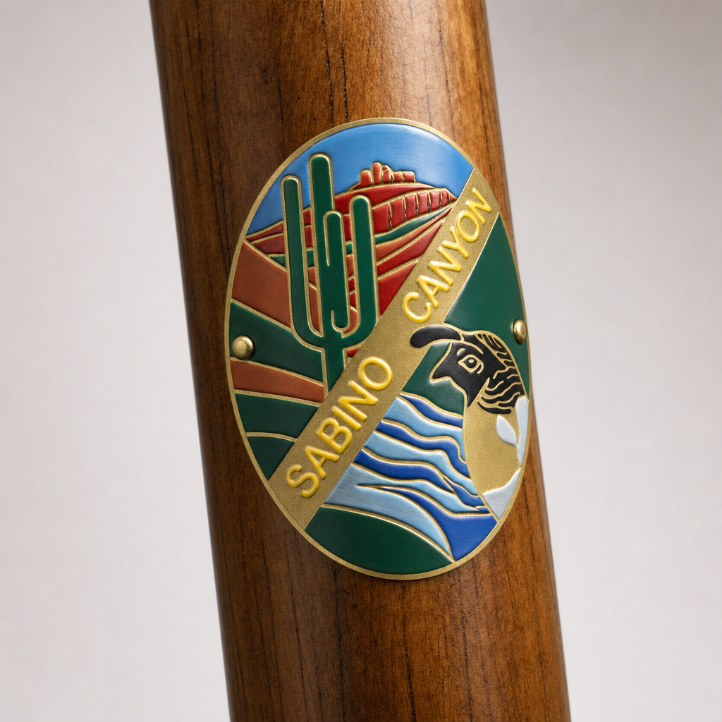 Sabino Canyon State Park hiking stick medallion installed on a wooden hiking staff
