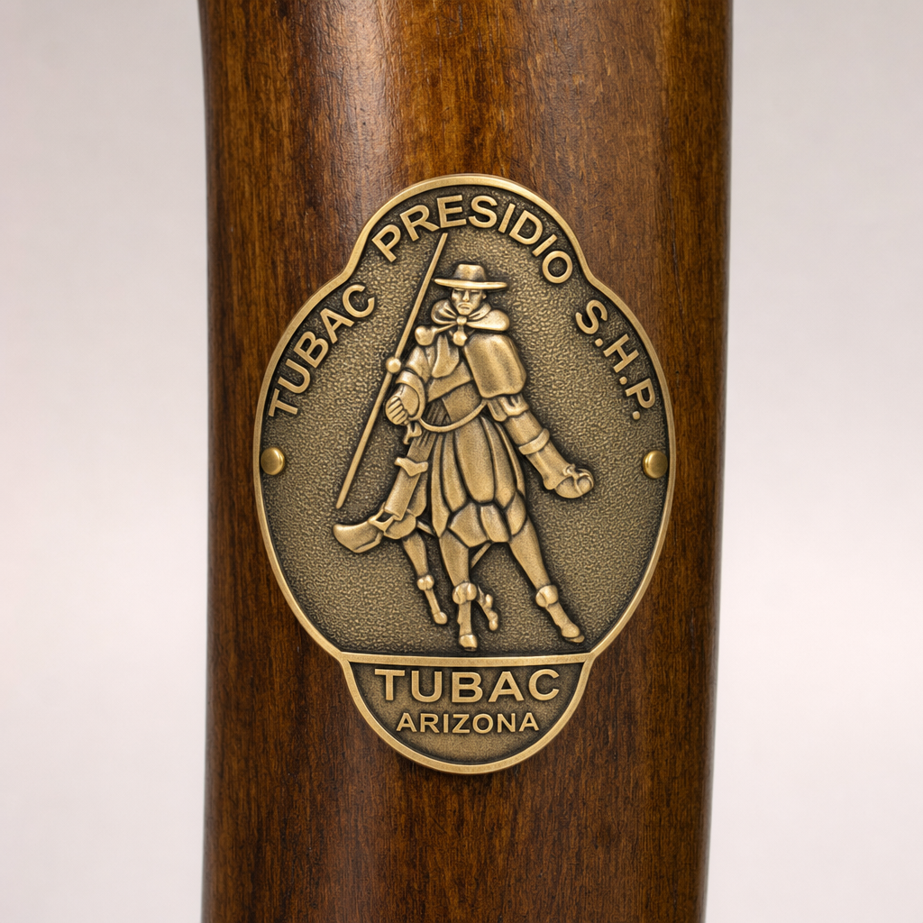 Tubac State Historical Site hiking stick medallion installed on a wooden hiking staff