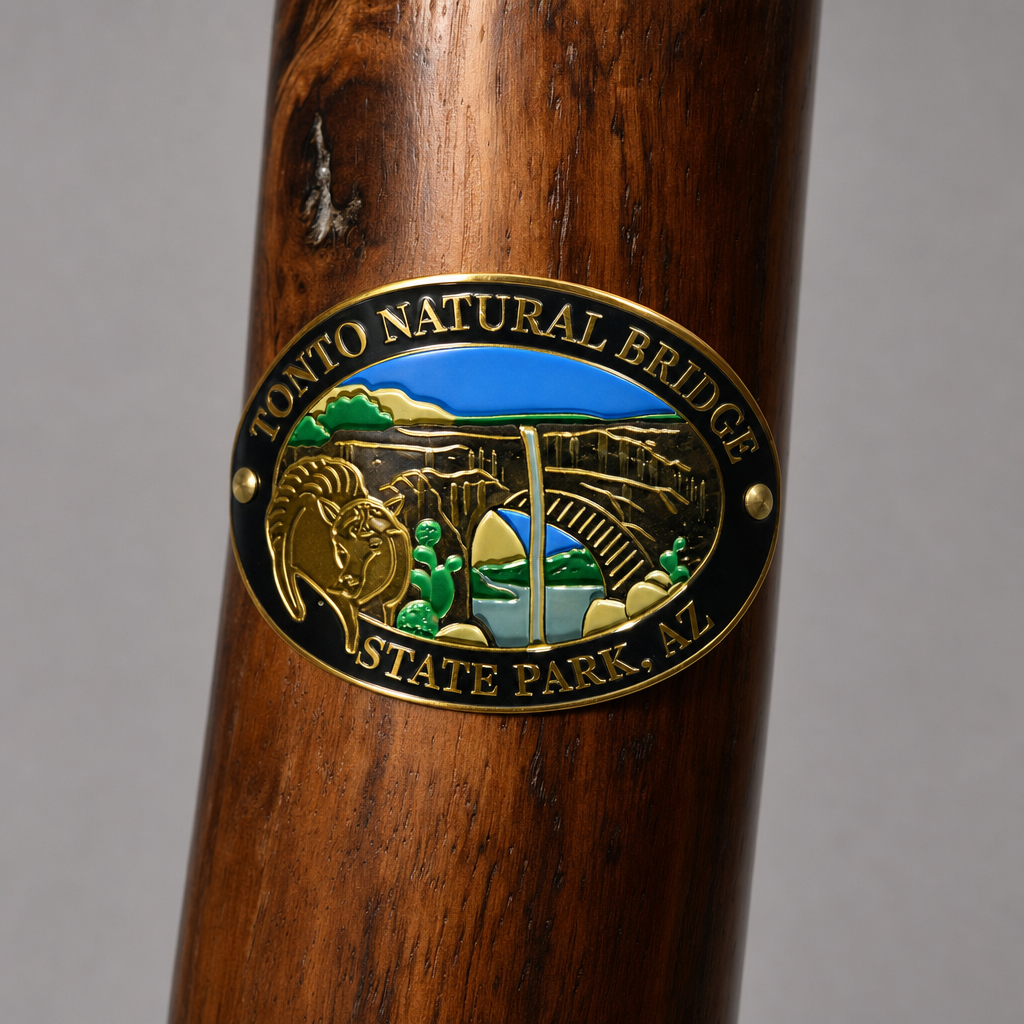 Tonto Natural Bridge State Park hiking stick medallion installed on a wooden hiking staff