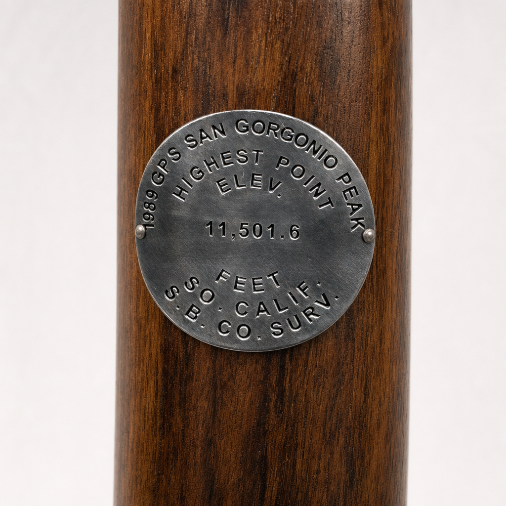 Mt. San Gorgonio GPS hiking stick medallion installed on a wooden hiking staff