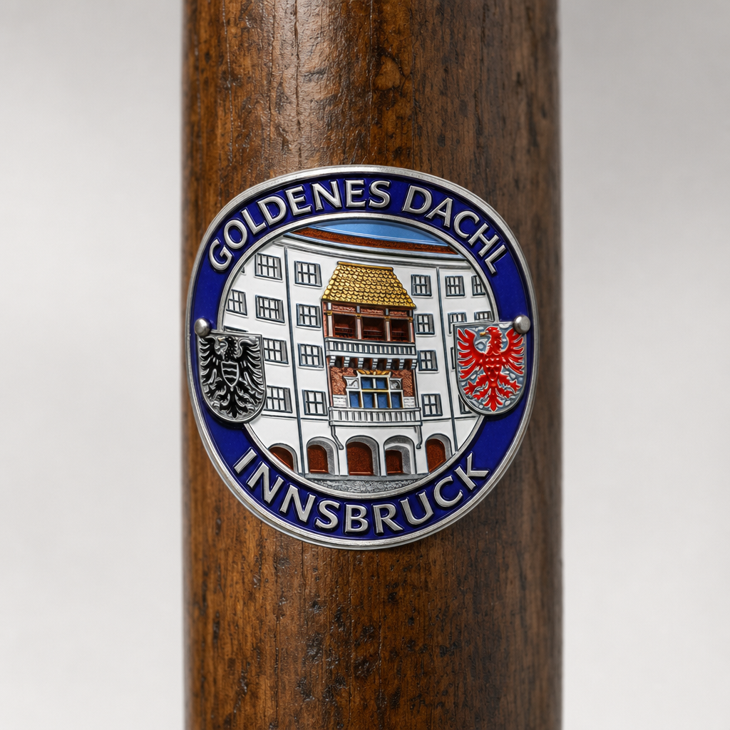 Innsbruck hiking stick medallion installed on a wooden hiking staff