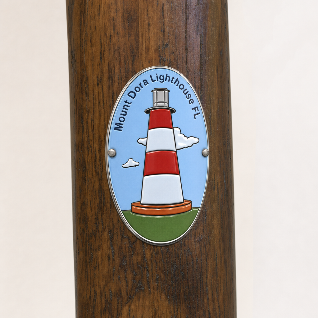 Mt. Dora Lighthouse hiking stick medallion installed on a wooden hiking staff