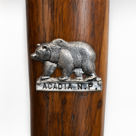 Acadia National Park Bear hiking stick medallion installed on a wooden hiking staff