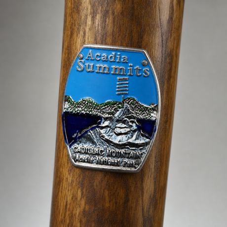 Acadia National Park Cadillac Mountain hiking stick medallion installed on a wooden hiking staff