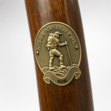 Acadia National Park hiking stick medallion installed on a wooden hiking staff
