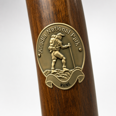 Acadia National Park hiking stick medallion installed on a wooden hiking staff