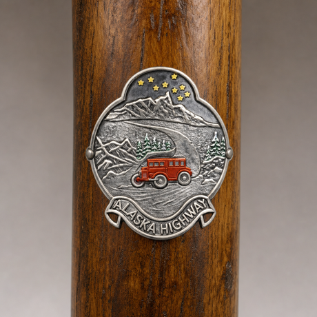 Alaska Highway State Park hiking stick medallion installed on a wooden hiking staff