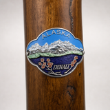 Denali National Park hiking stick medallion installed on a wooden hiking staff