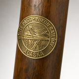 White Pass State Park Yukon Railway hiking stick medallion installed on a wooden hiking staff
