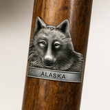 Alaska Wolf hiking stick medallion installed on a wooden hiking staff