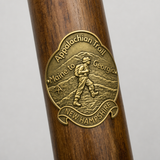 New Hampshire Appalachian Trail hiking stick medallion installed on a wooden hiking staff
