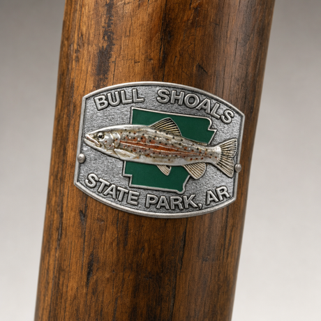 Bull Shoals State Park Logo hiking stick medallion installed on a wooden hiking staff