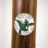 Devil's Den State Park Logo hiking stick medallion installed on a wooden hiking staff