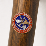 Crater of Diamonds State Park Logo hiking stick medallion installed on a wooden hiking staff