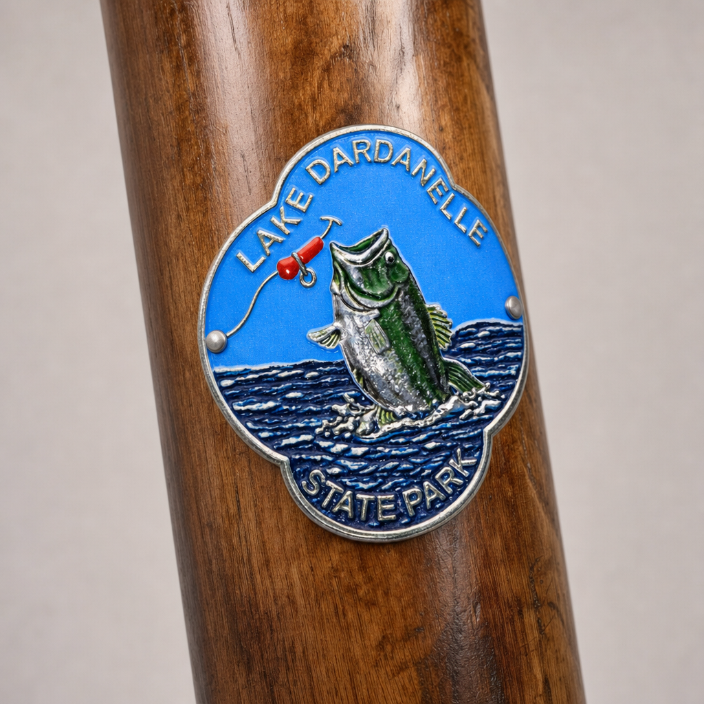 Lake Dardanelle State Park hiking stick medallion installed on a wooden hiking staff