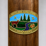 Moro Bay State Park hiking stick medallion installed on a wooden hiking staff