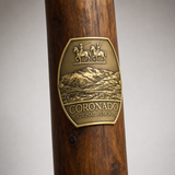 Coronado National Monument hiking stick medallion installed on a wooden hiking staff