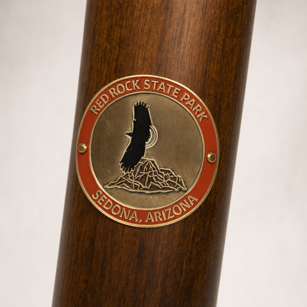 Red Rock State Park hiking stick medallion installed on a wooden hiking staff
