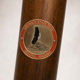 Red Rock State Park hiking stick medallion installed on a wooden hiking staff