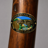 Tonto Natural Bridge State Park hiking stick medallion installed on a wooden hiking staff