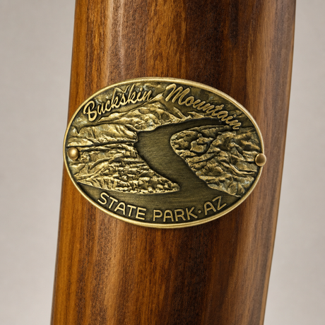 Buckskin Mt. State Park hiking stick medallion installed on a wooden hiking staff