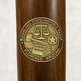 McFarland State Historic Park hiking stick medallion installed on a wooden hiking staff