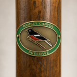 Ramsey Canyon Preserve hiking stick medallion installed on a wooden hiking staff
