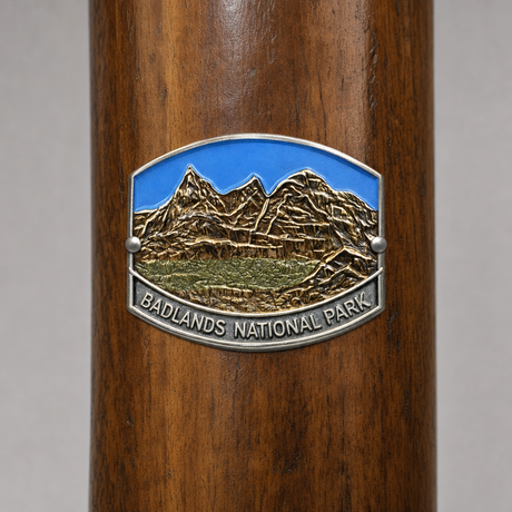 Badlands National Park hiking stick medallion installed on a wooden hiking staff
