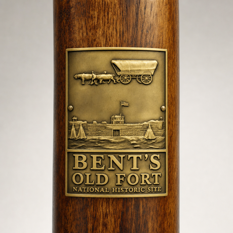 Bent's Old Fort National Historical Site hiking stick medallion installed on a wooden hiking staff