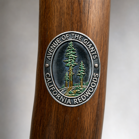 Avenue of the Giants State Park hiking stick medallion installed on a wooden hiking staff