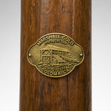 Marshall Gold Discovery State Park hiking stick medallion installed on a wooden hiking staff