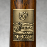 Mojave National Preserve hiking stick medallion installed on a wooden hiking staff