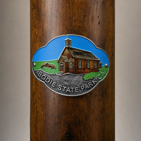 Bodie State Park hiking stick medallion installed on a wooden hiking staff