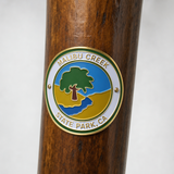 Malibu Creek State Park hiking stick medallion installed on a wooden hiking staff
