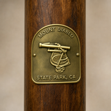 Mt. Diablo State Park hiking stick medallion installed on a wooden hiking staff
