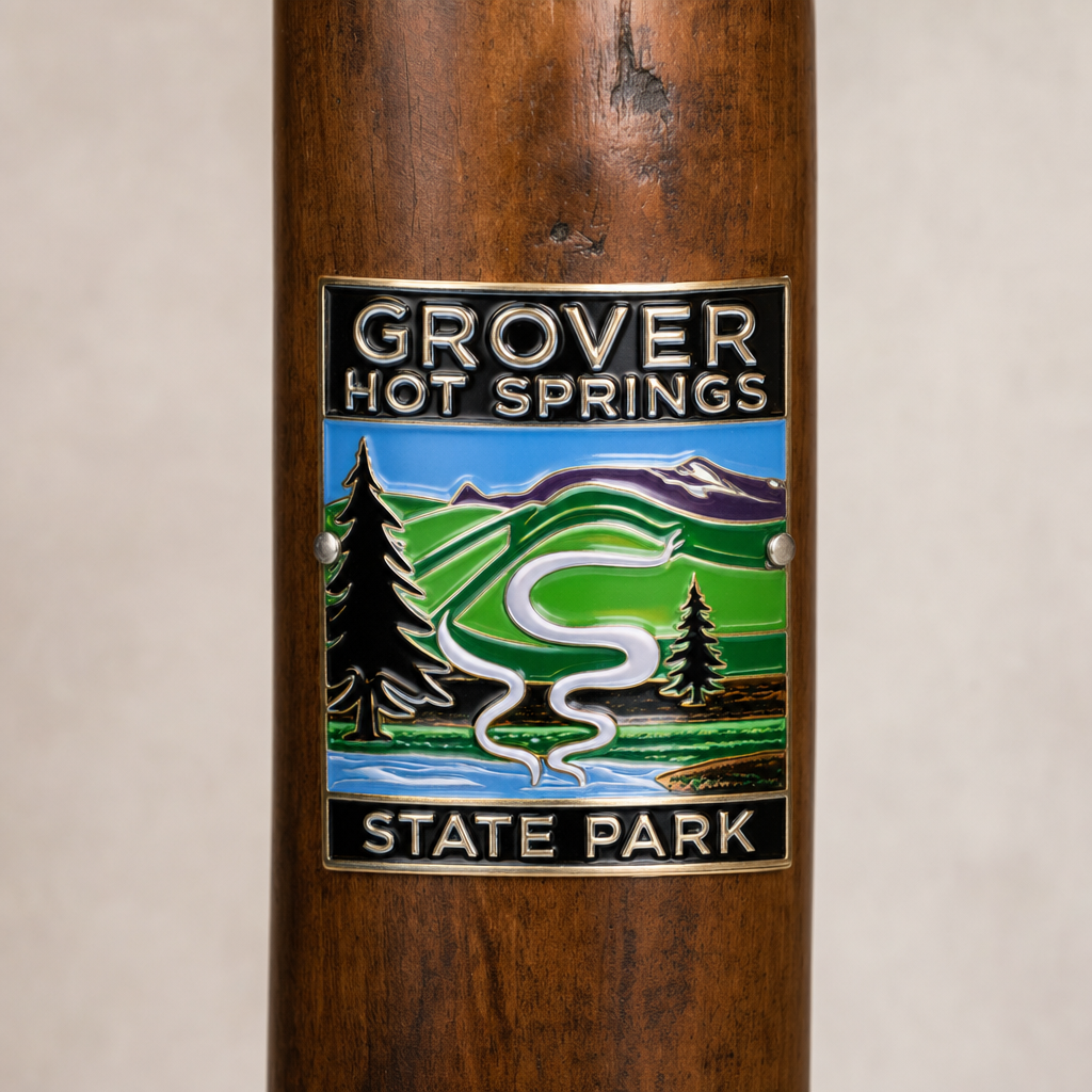 Grover Hot Springs State Park hiking stick medallion installed on a wooden hiking staff