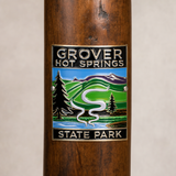 Grover Hot Springs State Park hiking stick medallion installed on a wooden hiking staff