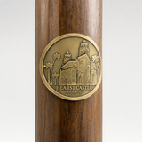 Hearst Castle - San Simeon hiking stick medallion installed on a wooden hiking staff