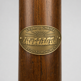 Cesar Chavez National Monument hiking stick medallion installed on a wooden hiking staff