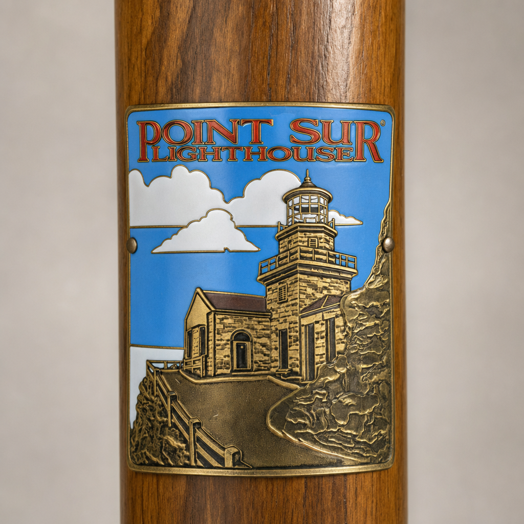 Point Sur Lighthouse hiking stick medallion installed on a wooden hiking staff