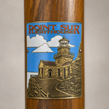 Point Sur Lighthouse hiking stick medallion installed on a wooden hiking staff