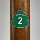 California State Route 2 hiking stick medallion installed on a wooden hiking staff