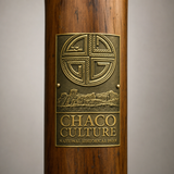 Chaco Culture National Monument hiking stick medallion installed on a wooden hiking staff