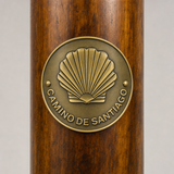 Camino De Santiago Trail hiking stick medallion installed on a wooden hiking staff