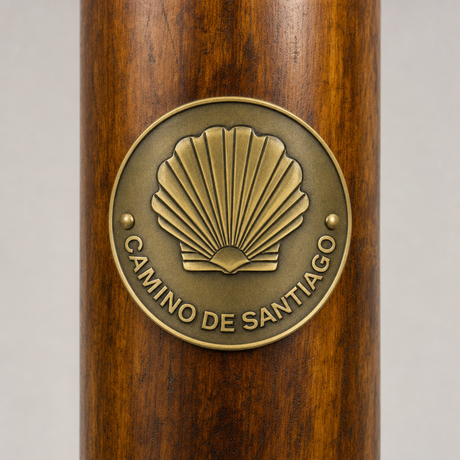 Camino De Santiago Trail hiking stick medallion installed on a wooden hiking staff