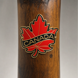 Canadian Maple Leaf hiking stick medallion installed on a wooden hiking staff
