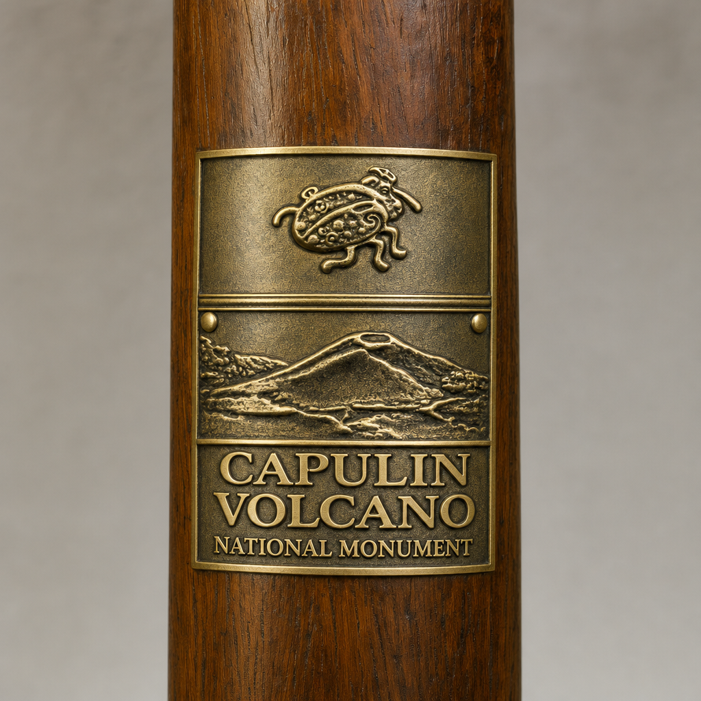 Capulin Volcano National Monument hiking stick medallion installed on a wooden hiking staff