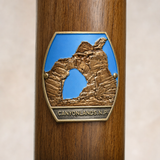 Canyonlands National Park hiking stick medallion installed on a wooden hiking staff